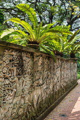 An Ornately Carved and Decorated Stone Wall in Fort Canning Park, Singapore