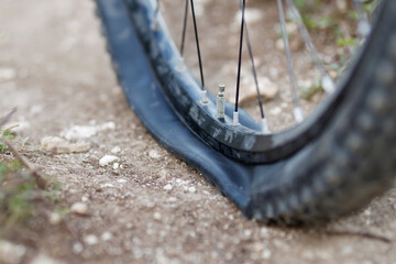 Mountain bike got Flat bike tire on trail. Selective focus..