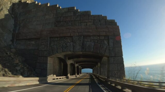 Driving in Big Sur California Cabrillo Highway 1 coast road, pov south, tunnel