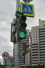 green traffic light on the street. Road safety.