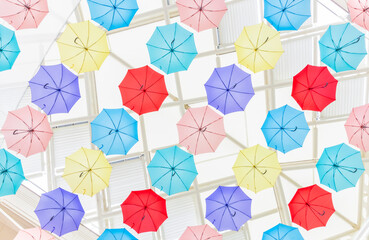 Fototapeta na wymiar Colorful umbrellas displayed in shopping mall