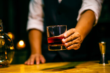 Barman pouring whiskey whiskey glass beautiful night