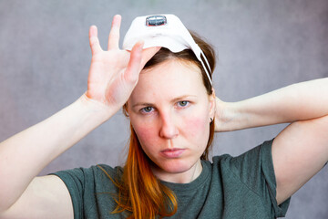 Beautiful woman wearing respiratory mask for the new rapidly spreading Coronavirus, COVID-19