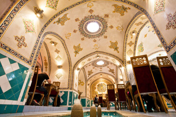 Fototapeta na wymiar Interior of retro restaurant with traditional painted walls and water fountains, Iran.
