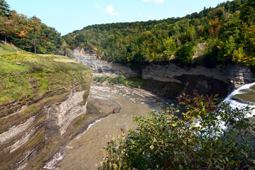 Fototapeta na wymiar Canyon with a river and green hills in Letchworth State Park