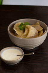 Homemade dumplings, Russian dumplings. dumplings, ravioli. on a wooden table