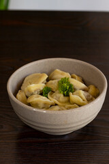 Homemade dumplings, Russian dumplings. dumplings, ravioli. on a wooden table