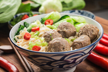 Chinese Food：Meatballs served with noodles,