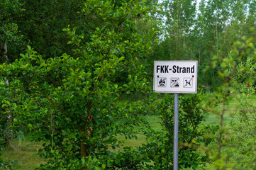 Signpost at Lake Olbersdorfer See marking the beginning of the nudist beach (FKK Strand)