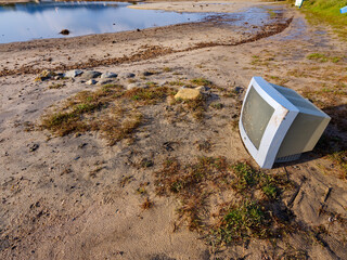 Garbage spilled on the beach. Pollution in ocean. Environment concept. Plastic pollution problem.