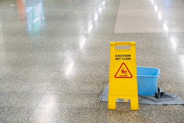 cleaning progress caution or warning wet floor sign in office