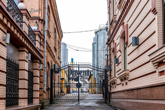 Rivne, Ukraine - January 6, 2020: Vintage building gate exterior in Western Ukrainian Rovno city with sign for beer brewery famous historic factory called Riven