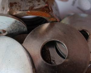 Close up image of metal washers, nuts and bolts in a pile