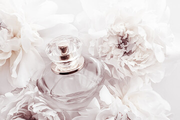 Chic fragrance bottle as luxe perfume product on background of peony flowers, parfum ad and beauty...