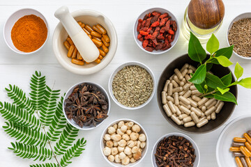 Herbal supplement in capsules with healthy medicinal plant.Alternative drug or natural pharmaceutical capsule.Medication of vitamin supplemental for care and treatment.Top view.