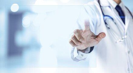 Doctor pointing finger on touch screen monitor.