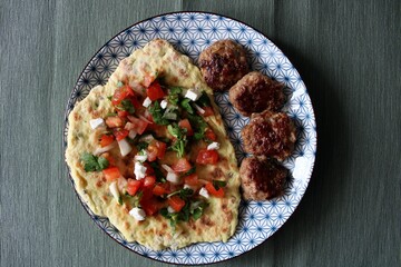 Pita Bread with Grilled Beef Meat and Fried Potato Covered Sesame Seeds. Roasted Meal