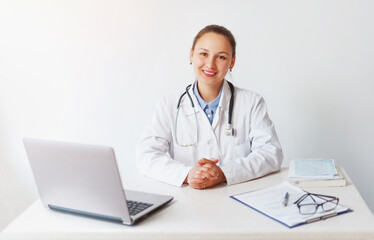 portrait of a smiling female doctor at her workplace