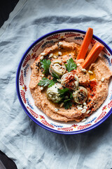 Vegan carrot hummus with antichokes 