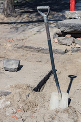 shovel driven into the ground, Construction site