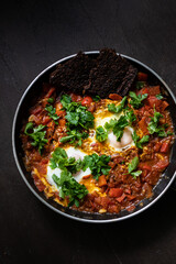 Jewish fried eggs with tomato sauce 