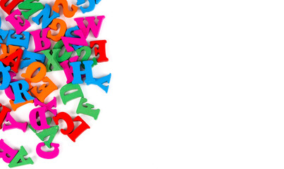 Letters of the alphabet are randomly scattered on a white background.