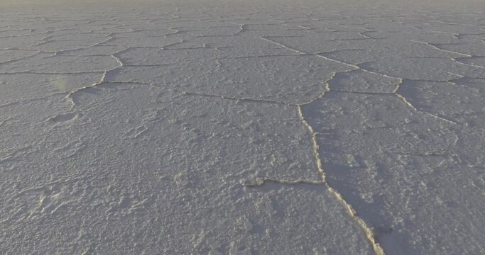 Hexagon Tiles in Uyuni Salt Flat at Sun Rise Travelling Aerial shot in V-Log