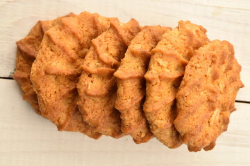 Fragrant tasty, sweet cereal cookies, close-up, on a white wooden table.