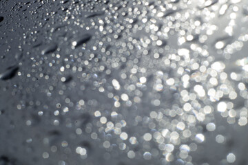 drops of pod on frosted glass on a dark background