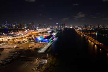 Obraz premium Rainbow pride colors Royal Caribbean cruise ship terminal Port Miami night aerial photo