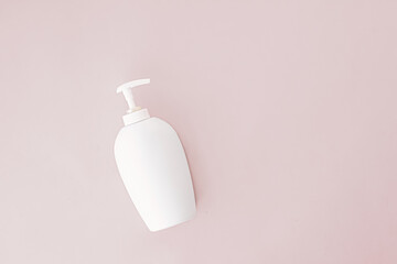 Bottle of antibacterial liquid soap and hand sanitizer on beige background, hygiene product and health care concept