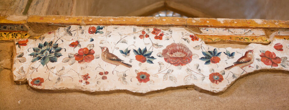 Faded frescoes from 17th century inside the historical Hasht Behesht Palace in Isfahan, Iran.