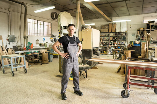 Worker looking at camera in a factory.
