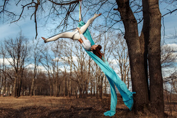 girl in white on a Hoop in the woods