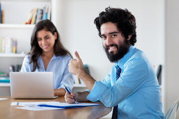 Successful arabic businessman with female colleague