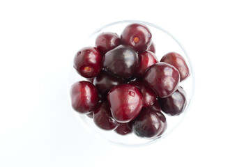 Sour cherries, close-up view. White background.