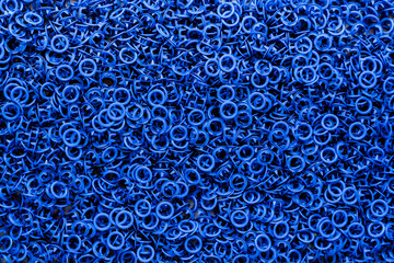 Blue eyelets, sewing accessories, jewelry for clothing.Space for text