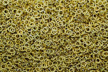 Gold-colored grommets, sewing accessories, jewelry for clothing.Space for text