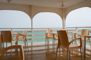 Cafe in inclement weather on the beach is empty
