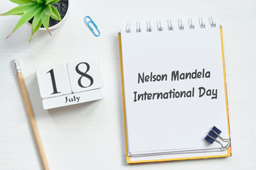 18th july eighteenth day month Nelson Mandela International Day calendar concept on wooden blocks. - obrazy, fototapety, plakaty