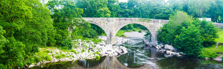 Fototapeta premium Panorama view of the Devils bridge and River Lune in Kirkby Lonsdale in Cumbria