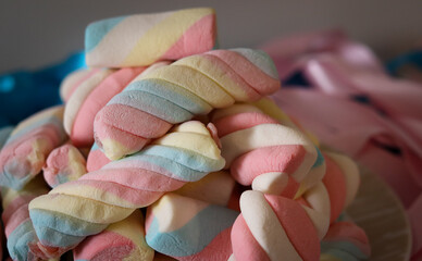 Different types of colorful marshmallows that decorate and give beauty to a party table.