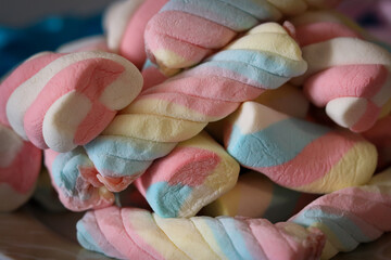 Different types of colorful marshmallows that decorate and give beauty to a party table.