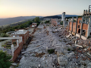 Abandoned factory and power plant  made mostly out of brick walls at sunset near Danube River, deep...