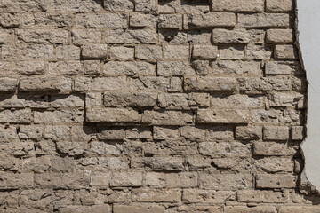Beautiful horizontal texture of part of an old orange crushed brick wall