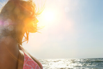 Attractive woman in bikini staring and sunshine
