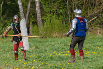 Details of the ancient uniform of knights in armor and helmets, the era of the 15th century.