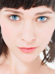 Obraz premium Close up of Young atrractive Brunette Woman with blue eyes
