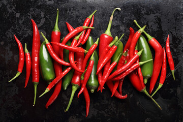 Fresh hot peppers on a dark background
