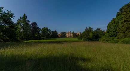 Lednice castle with fresh color spring garden in sunny morning